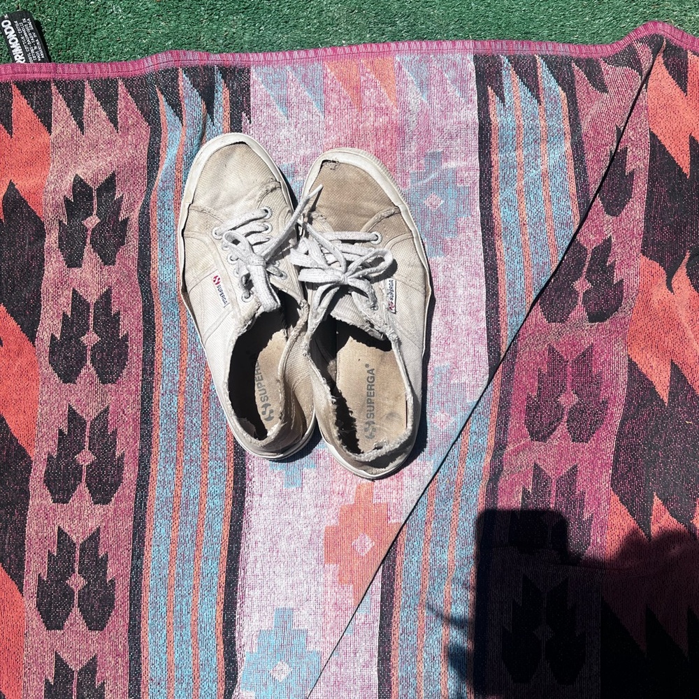 white superga sneakers (similar to converse) well worn